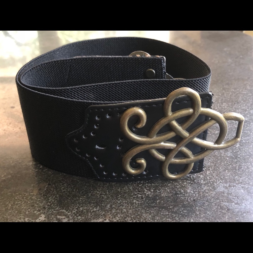 Black stretch belt with intricate black clasp.